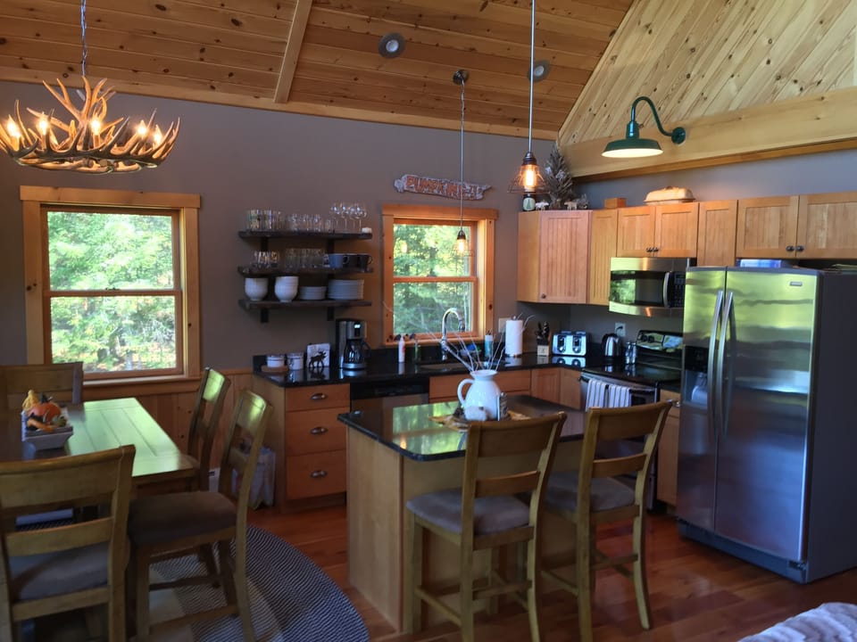 Granite counters, high-end appliances, pots, pans, and service for at least 8