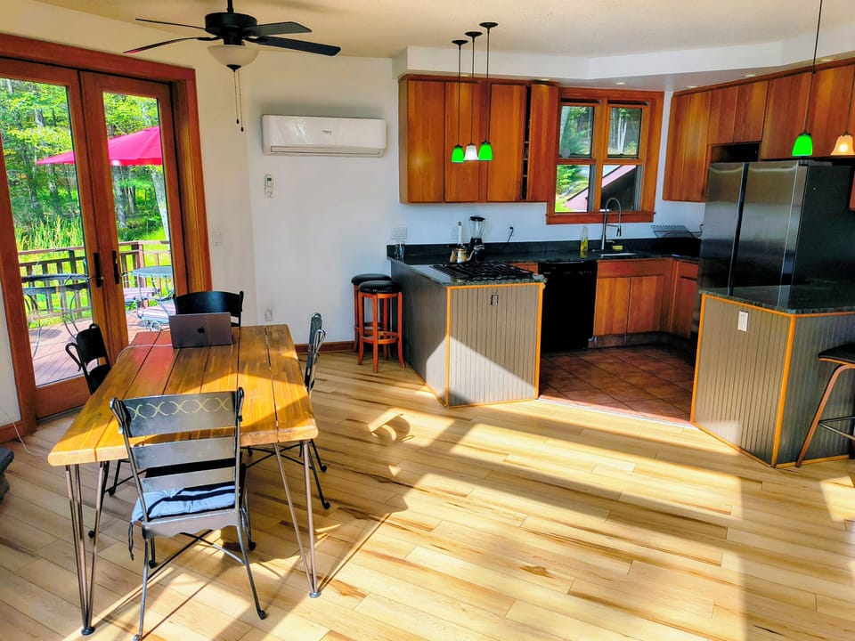 Living Room & Kitchen area
8 Person table + bar stools