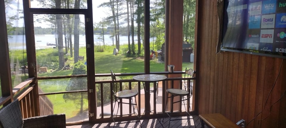 Screened Porch with 65" Flat Screen facing outdoor Hot Tub