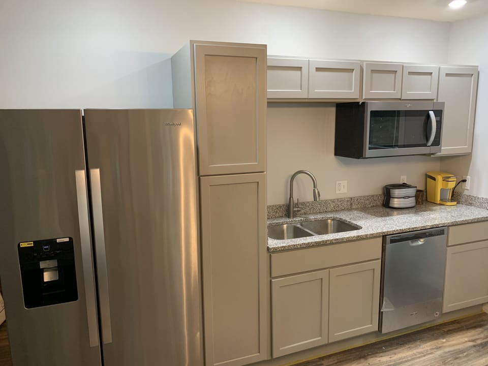 Kitchen in new room over garage.  Yes that's a dishwasher