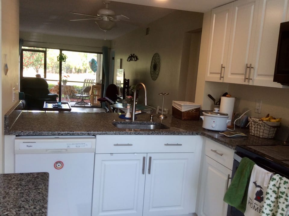 Granite kitchen counter 
opened to living room
