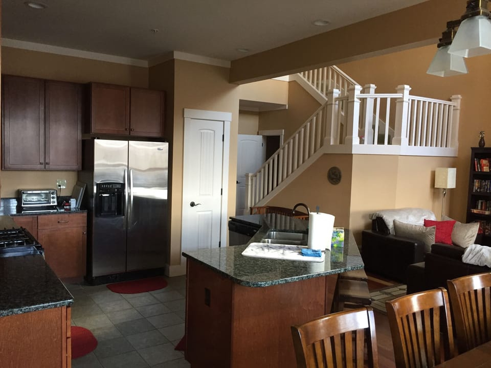 The kitchen and stairs from dining table - two USB charging outlets nearby