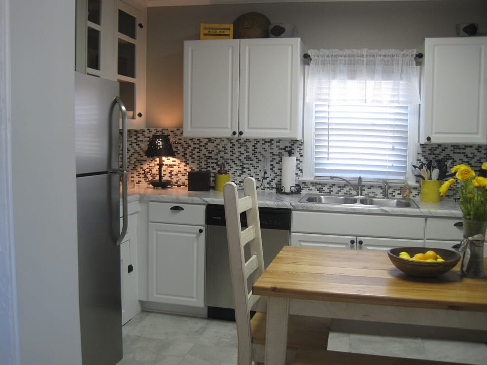 Eat in kitchen is fully equipped and cheerfully decorated. Accommodates 6-8.