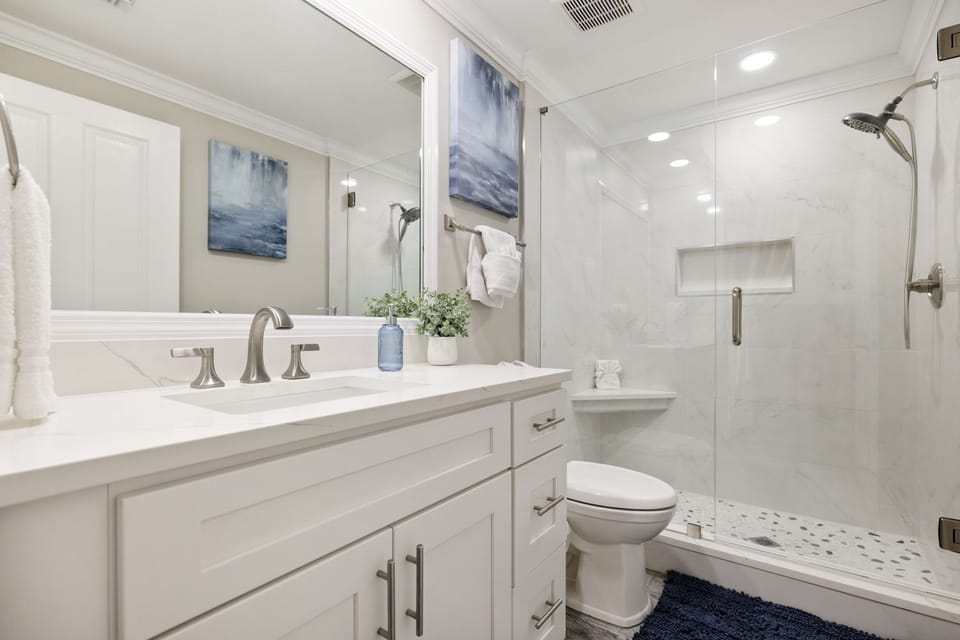 Hall bath has new quartz countertops, cabinets, oversized shower with bench seat
