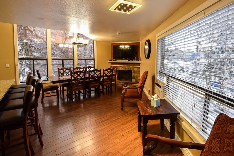 Dining room with wood burning fire place, and TV