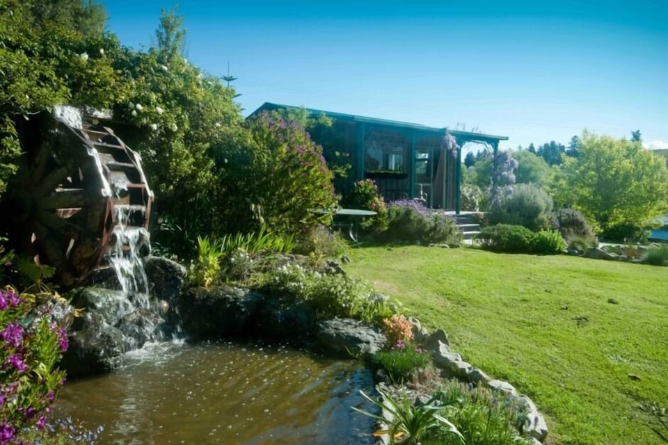 Waterwheel beside cottage