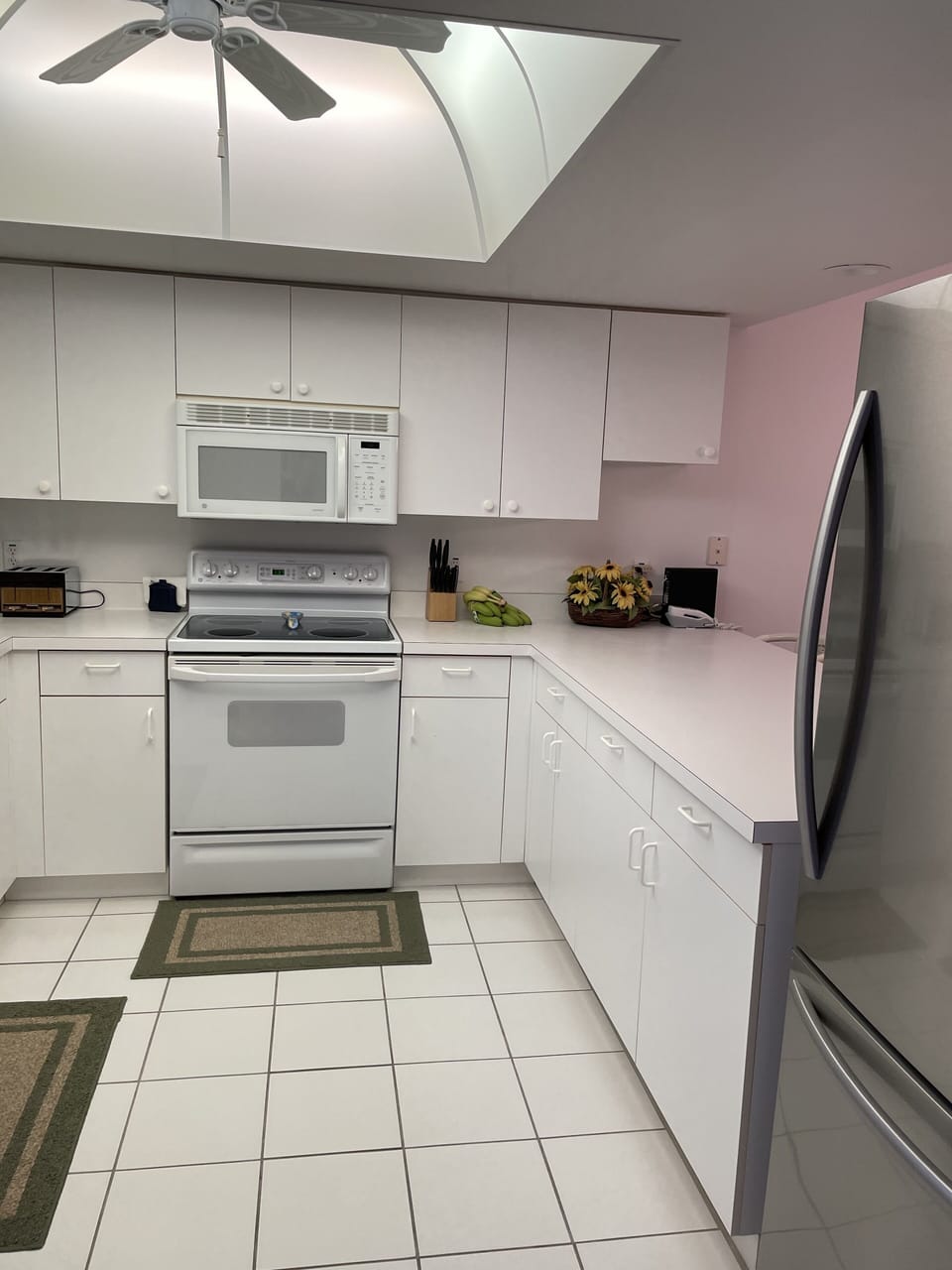 Open bright kitchen with new appliances