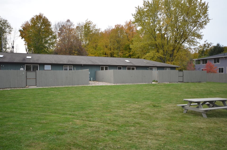 Open, grassy common area shared by only 9 units