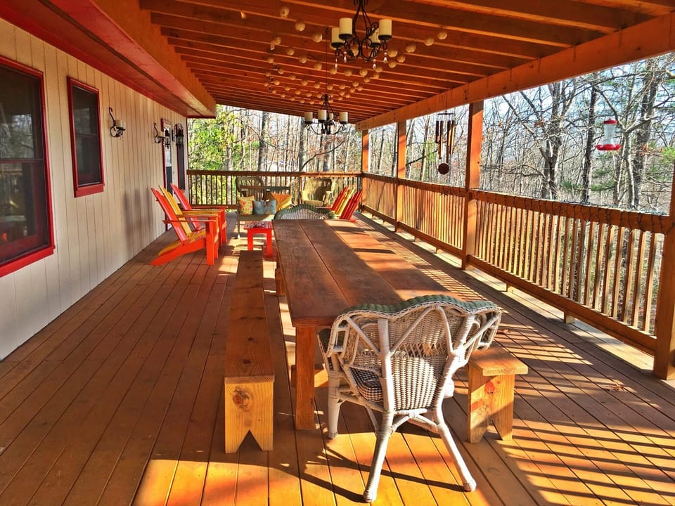 The deck on the main level with 12' table and  benches for outdoor dining.
