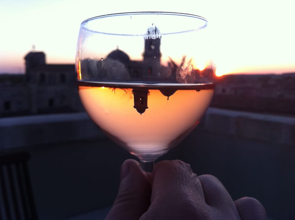 At dusk on the terrace, the sky and the rose' wine become the same color