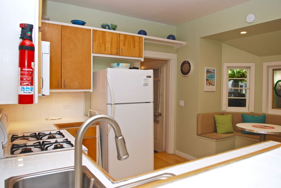 Kitchen is fully outfitted with dishes, utensils, glasses, pot & pans, etc