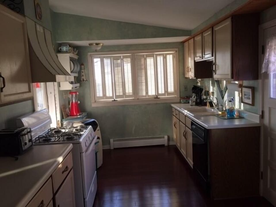 Overview of kitchen facing lake.  Private two car parking to right.