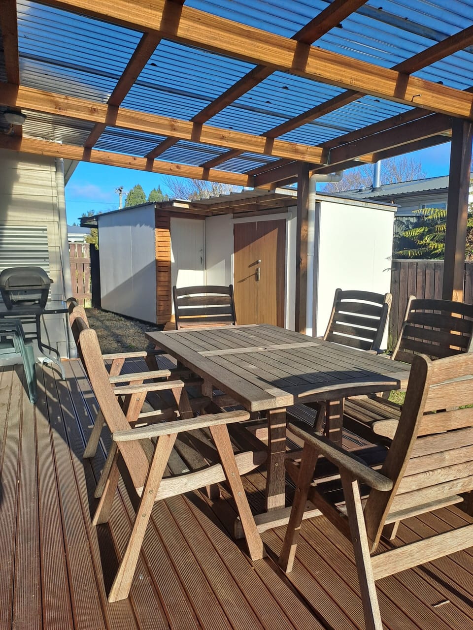 Deck with outdoor furniture, Bike shed with deadlock, and woodshed. 
