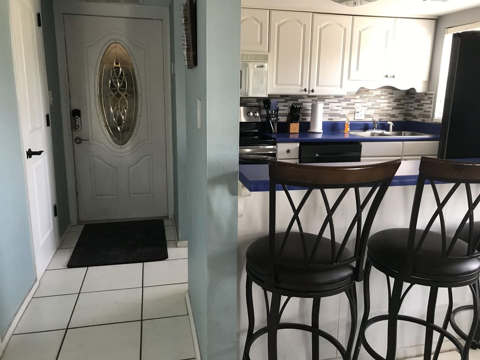 Front Entry and Kitchen View from Family Room