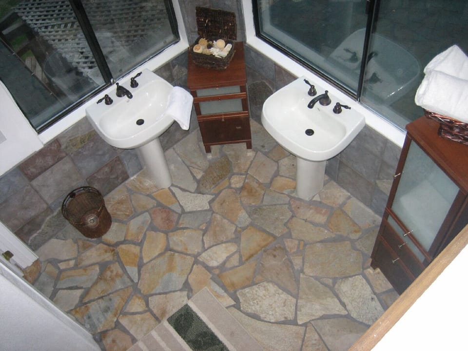 Upstairs bathroom with walk-in stone shower
