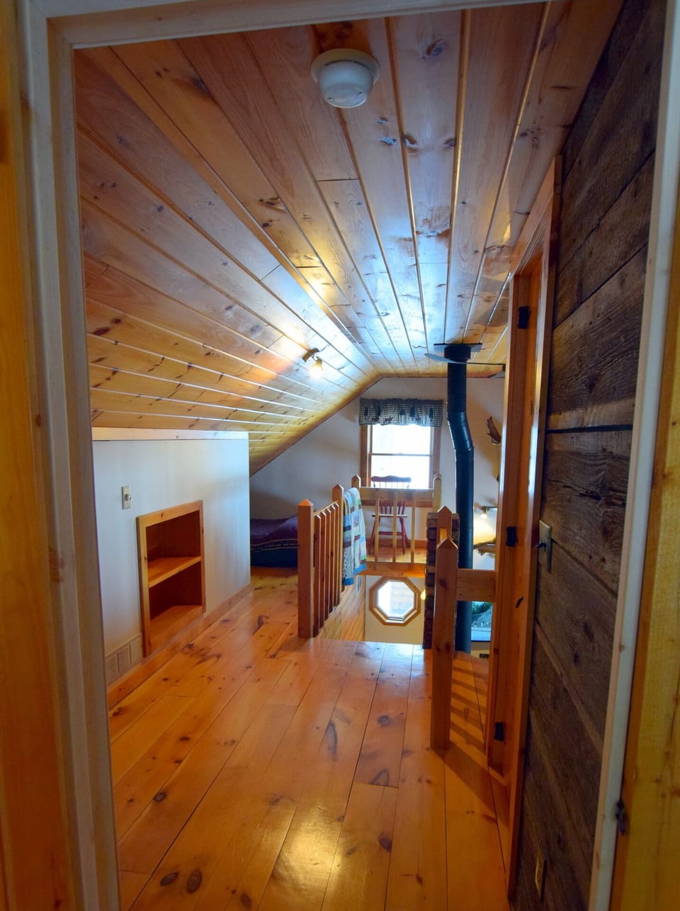 Upstairs hall leading from bedroom to loft area