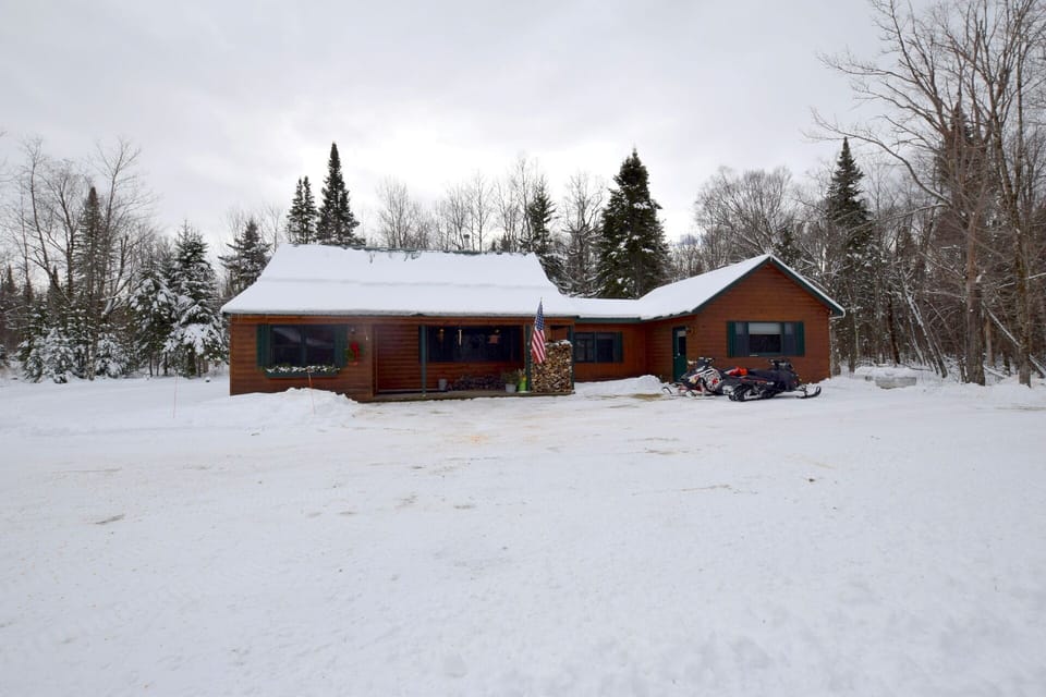 Plenty of wood for the woodstove and parking for your sleds, atv's or other toys