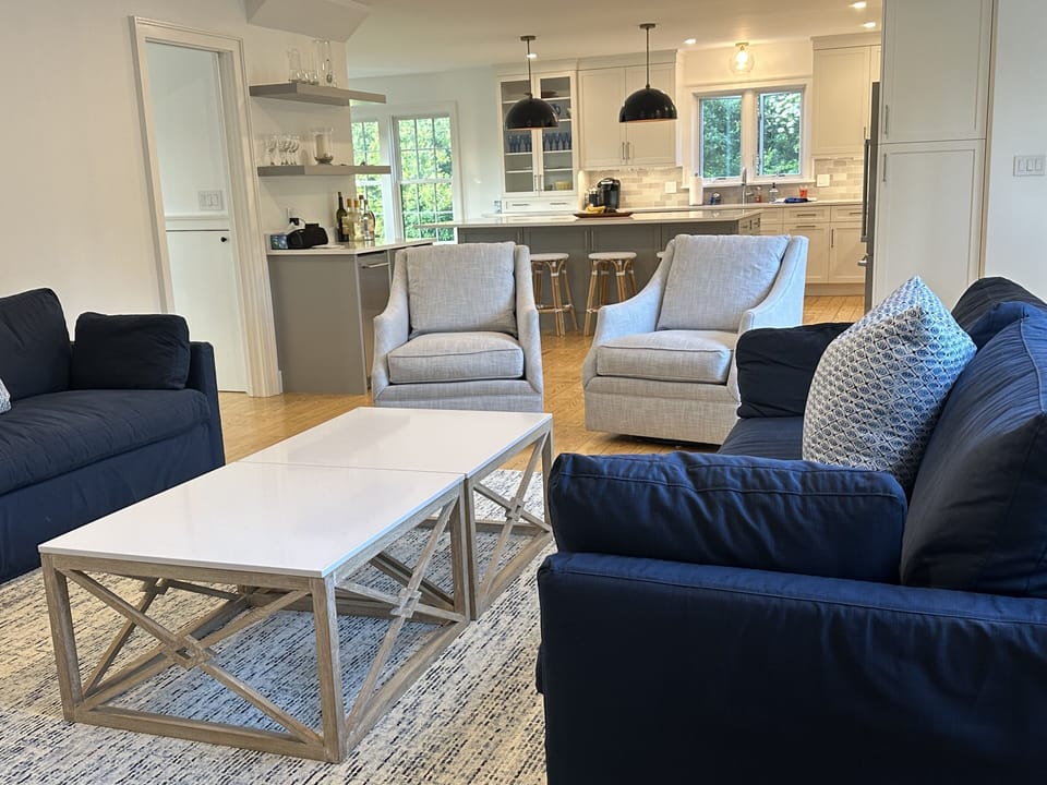 main living room area/ open to kitchen with sliders to back deck