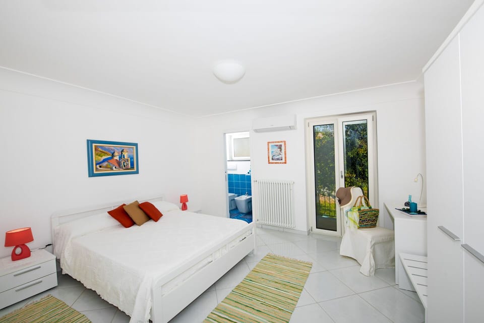 the second bedroom with a private bath and  terrace at same floor of the living 