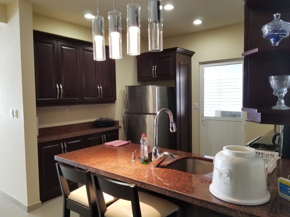 Spacious modern kitchen with full size refrigerator