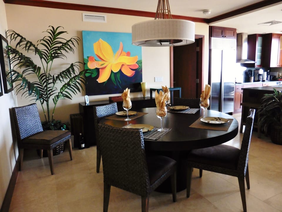 The dining area seats 6, and displays original art pieces from renowned artists.
