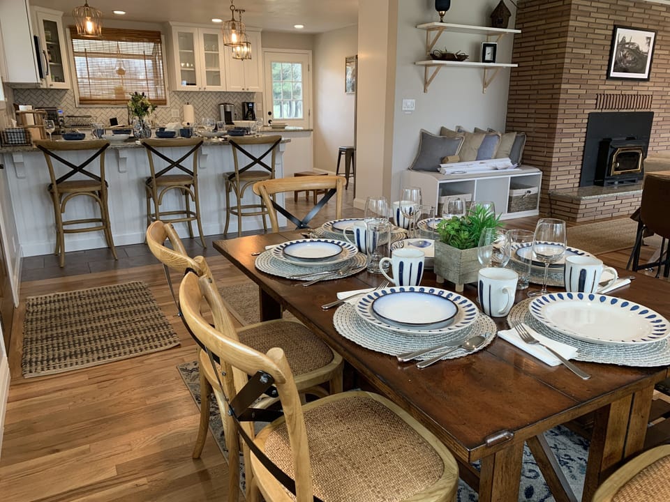 Enjoy meals and conversations at dining table and  peninsula while watching the river
