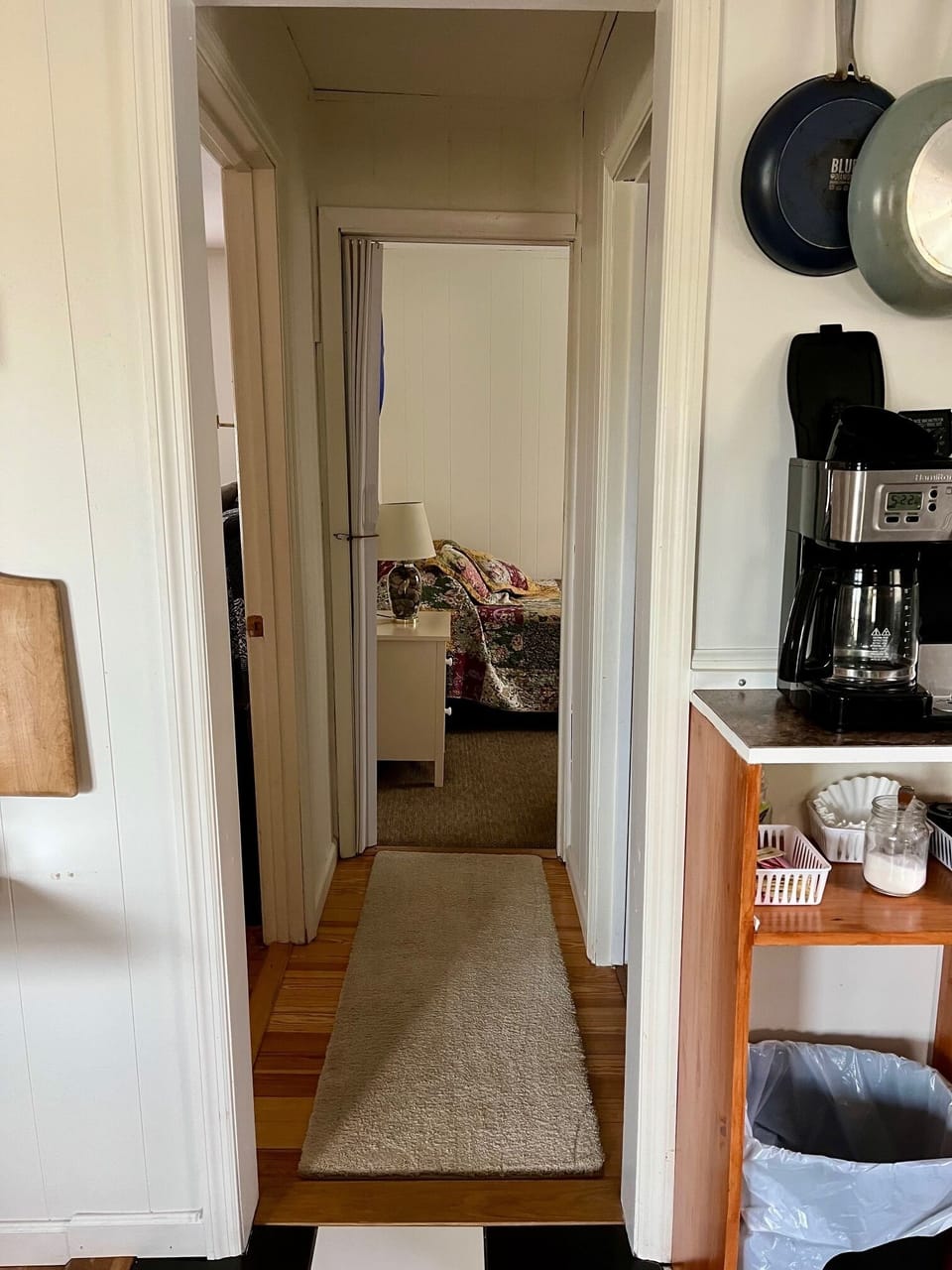 hallway to rear bedroom, bathroom, and laundry area