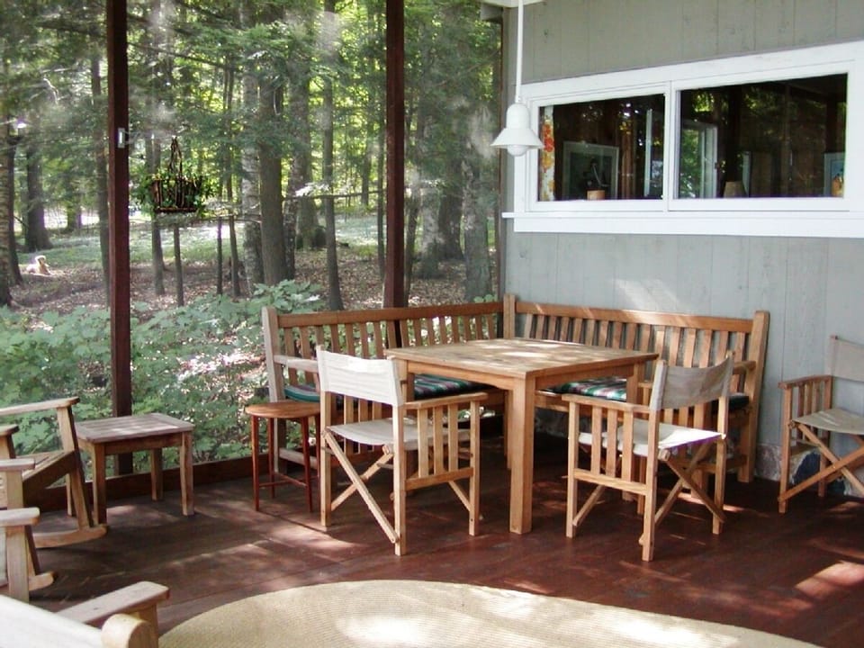Corner seating on screen porch for eating + games