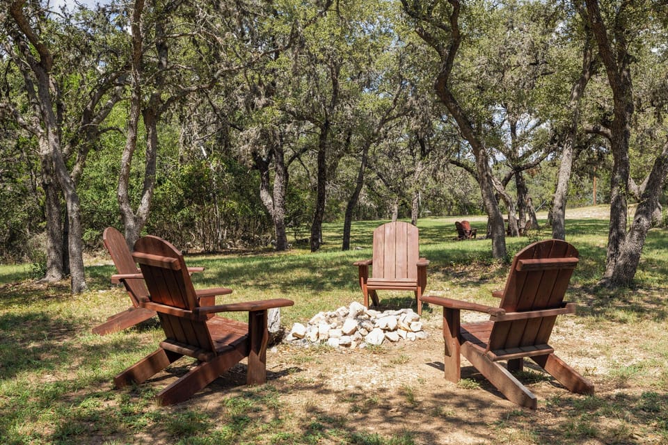 Adirondack chairs surrounding the fire pit