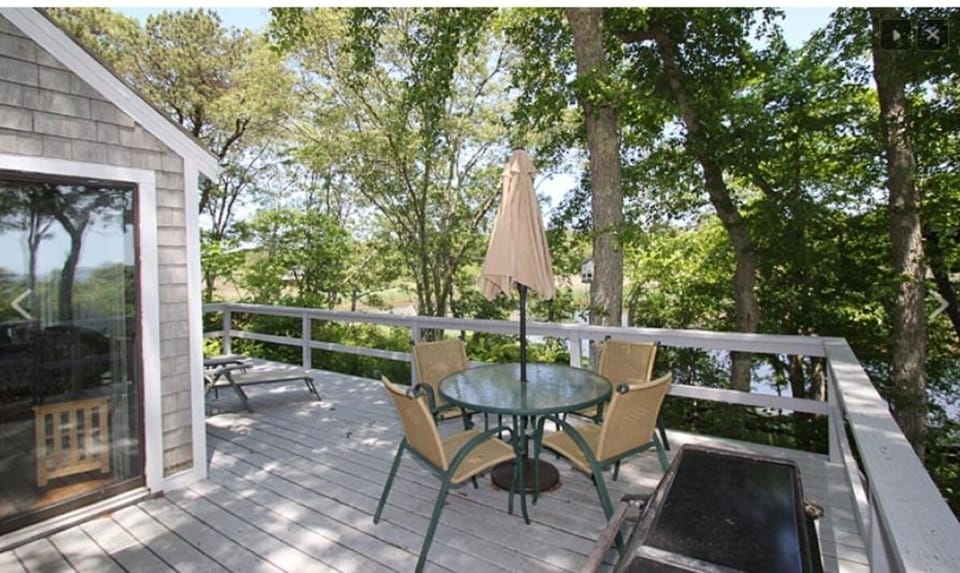 Large private deck overlooks tidal estuary and Nantucket Sound. 