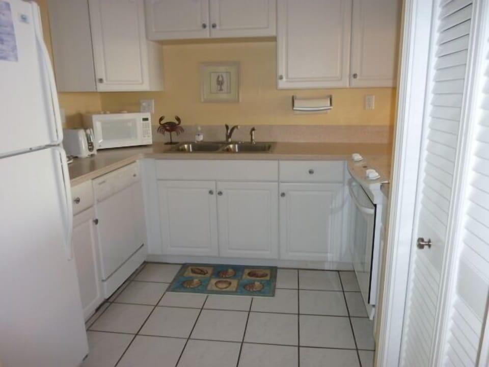 Kitchen with corian counter tops.