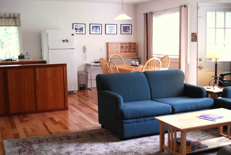 Living room, dining and Kitchen to the left. Teal color coach has been replaced.