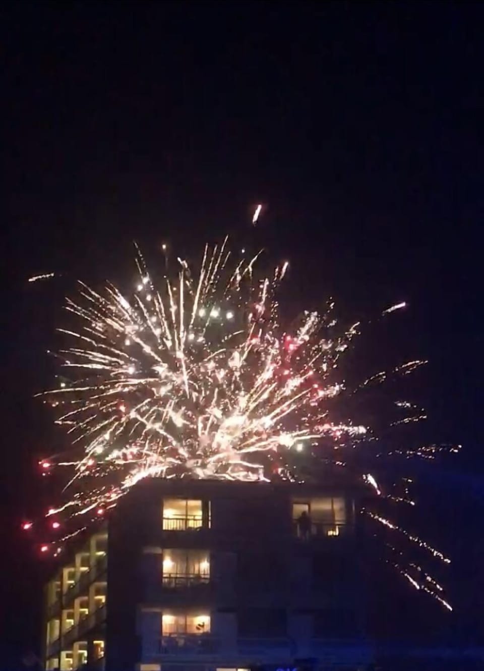 Fireworks display from the Halifax River seen above building.