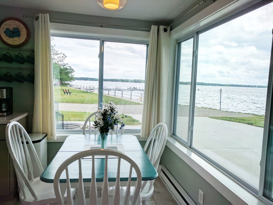 Dining room with beautiful views of Lake Missaukee! Plus add'l table and chairs.