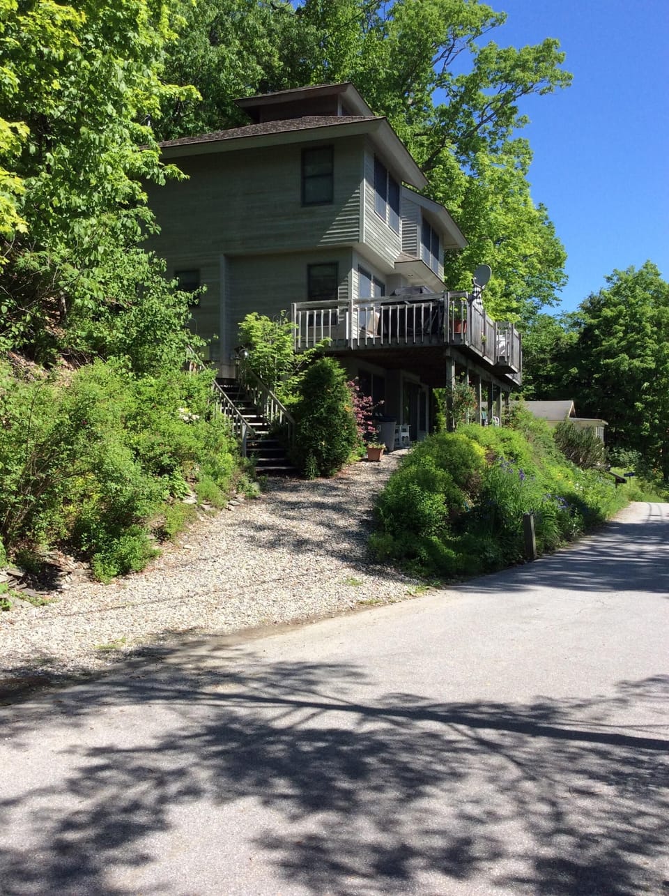 view of the house from the end of the driveway facing north
