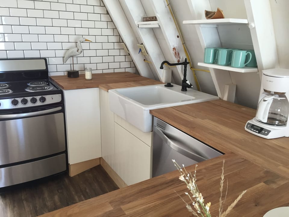 New Ikea Kitchen, efficient cabinets put everything in reach.
