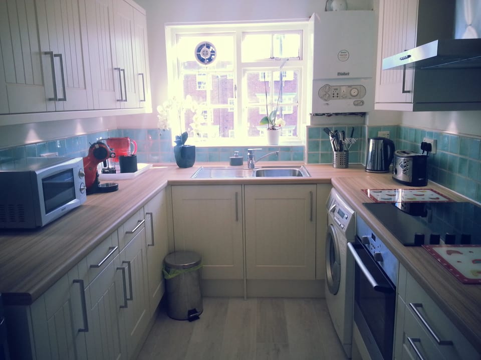 new fitted kitchen equipped with washing/dryer machine