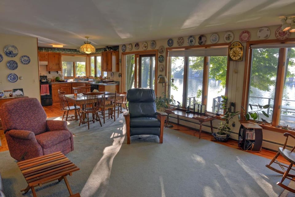 The kitchen, dining area and living room all look out over the water.