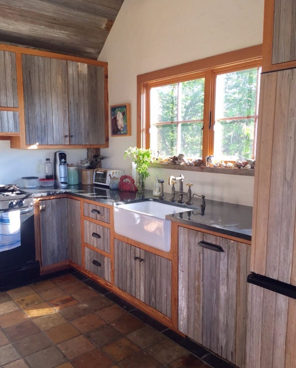 Well appointed kitchen with dishwasher, toaster oven, propane stove, microwave 