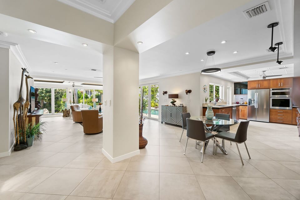 Front entry expands to the open layout with views to the pool and back landscape