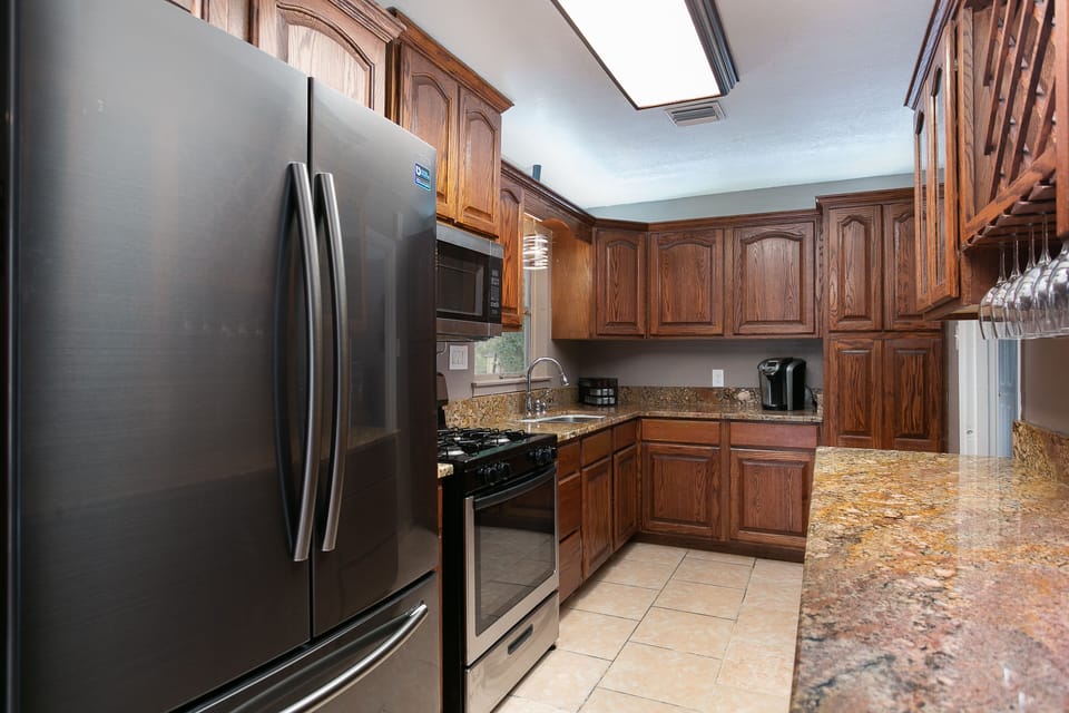 Beautiful kitchen with wood  cabinetry, granite countertops and new appliances.