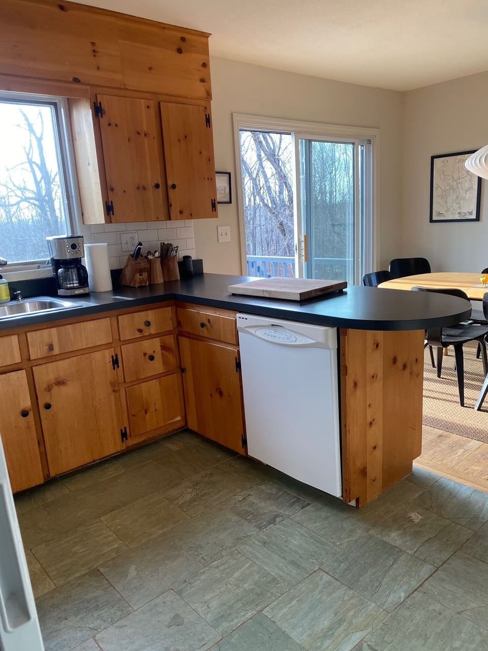 Kitchen area with view to slider to deck