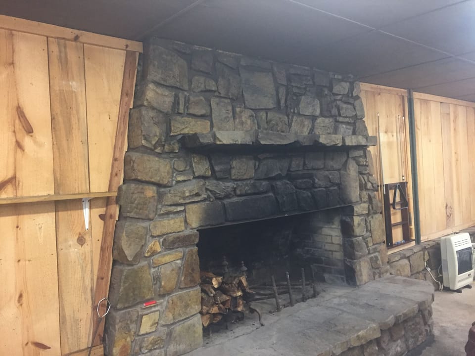 Shared Game Room Access: fireplace with firewood provided