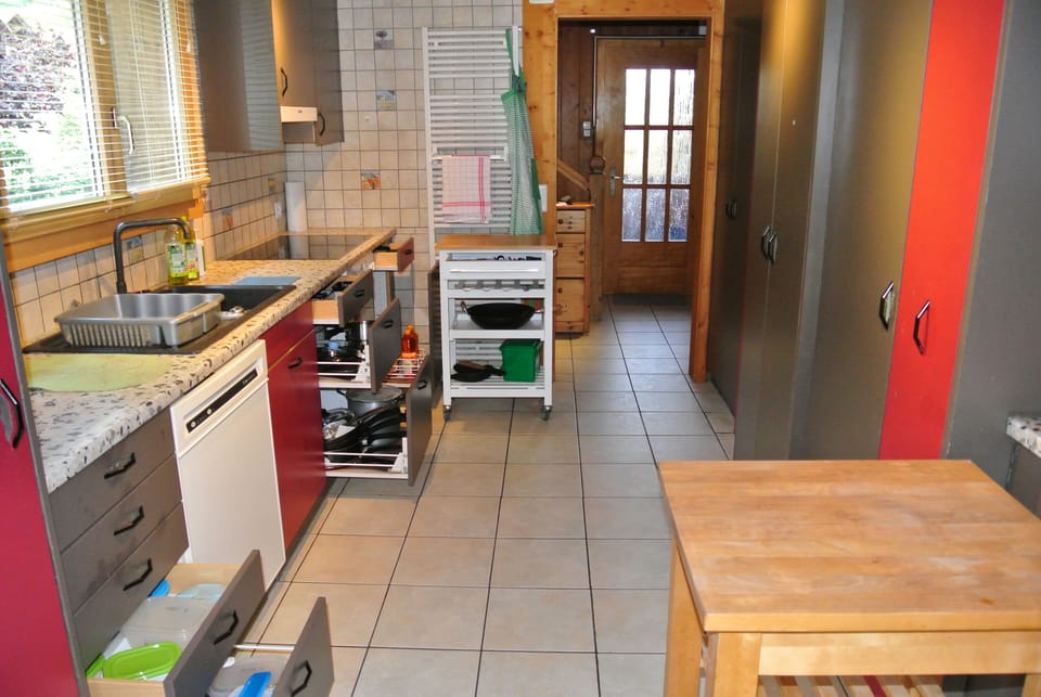 View of the working area of the kitchen, in the direction of the entrance hall.