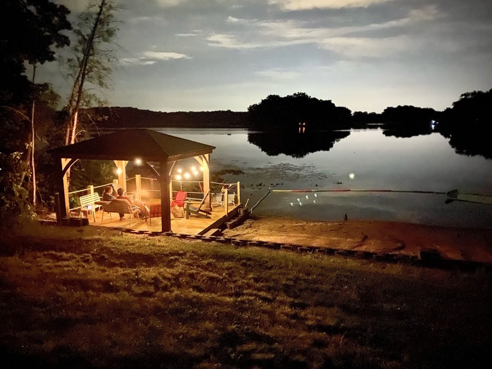 Lakefront gazebo—covered with chairs and sand toys for your use.