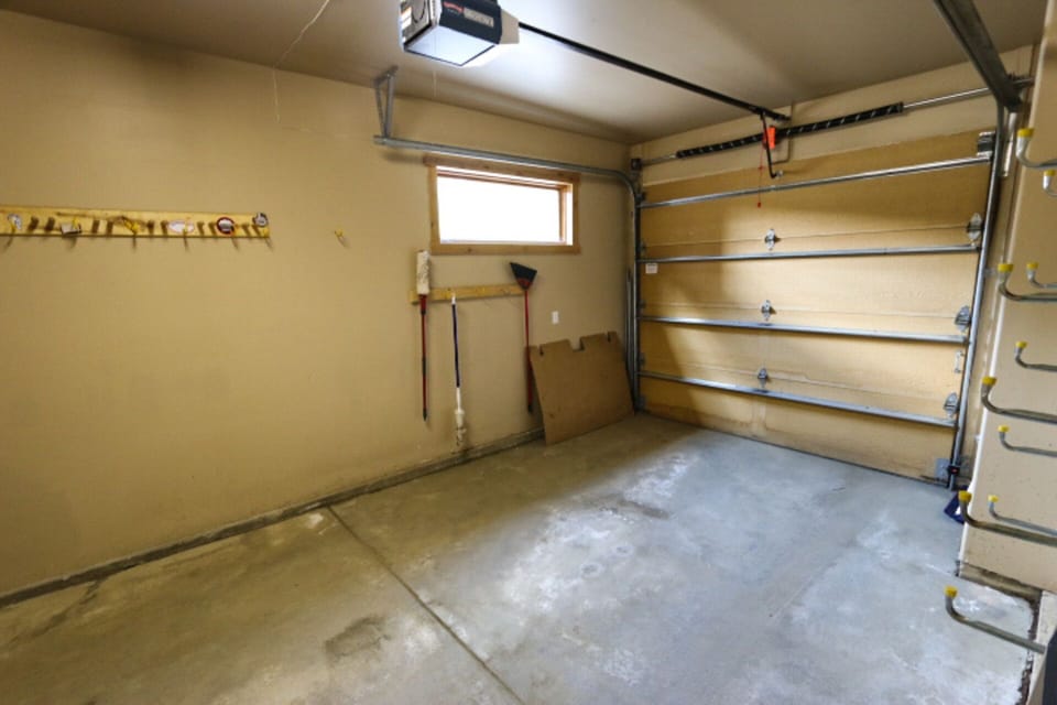 Private garage has ski and snowboard storage