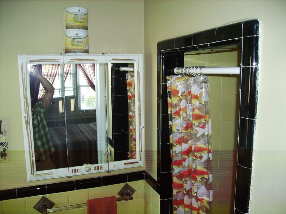 Bath with stall shower off master bedroom