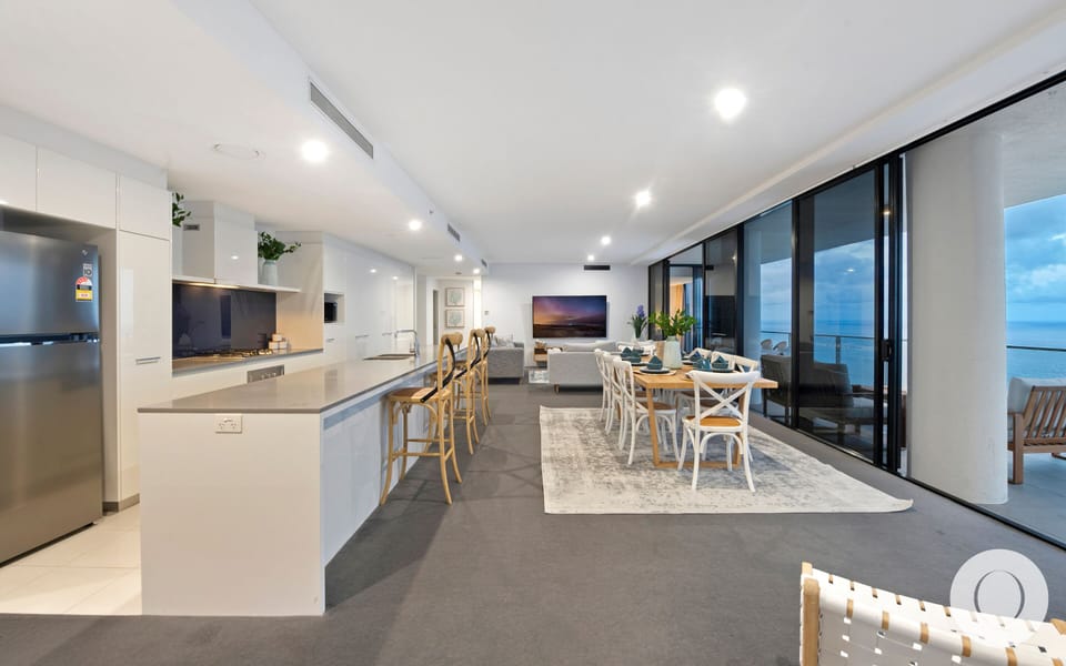 Fully equipped modern kitchen is right next to the dining area and the balcony