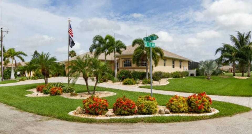 Front and side of house showing circular driveway