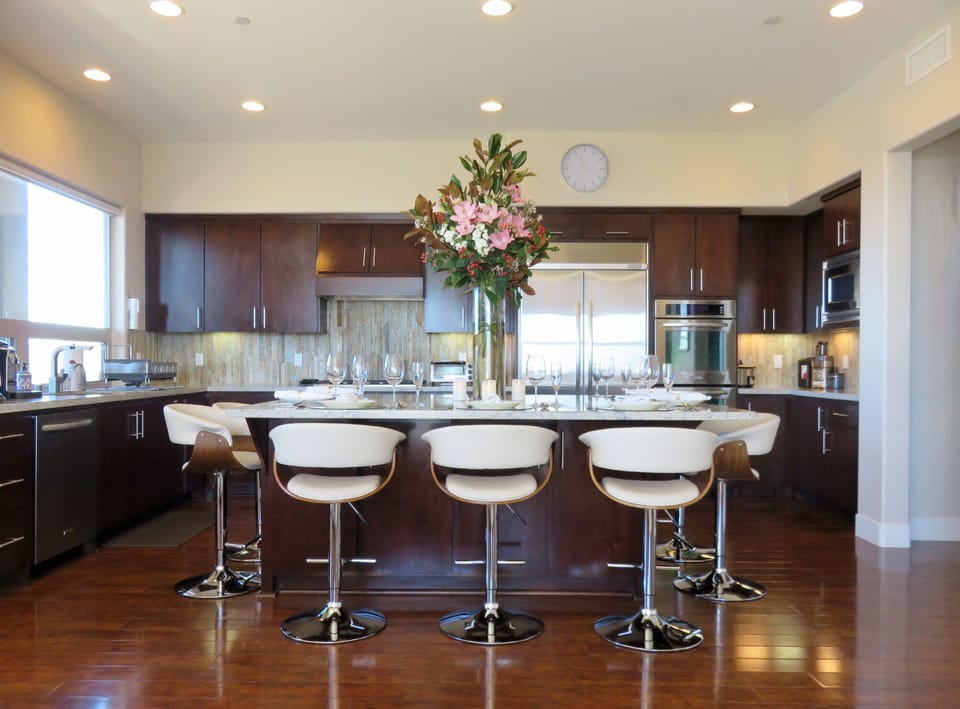 Large kitchen with granite island that is great for brunches and wine tastings.